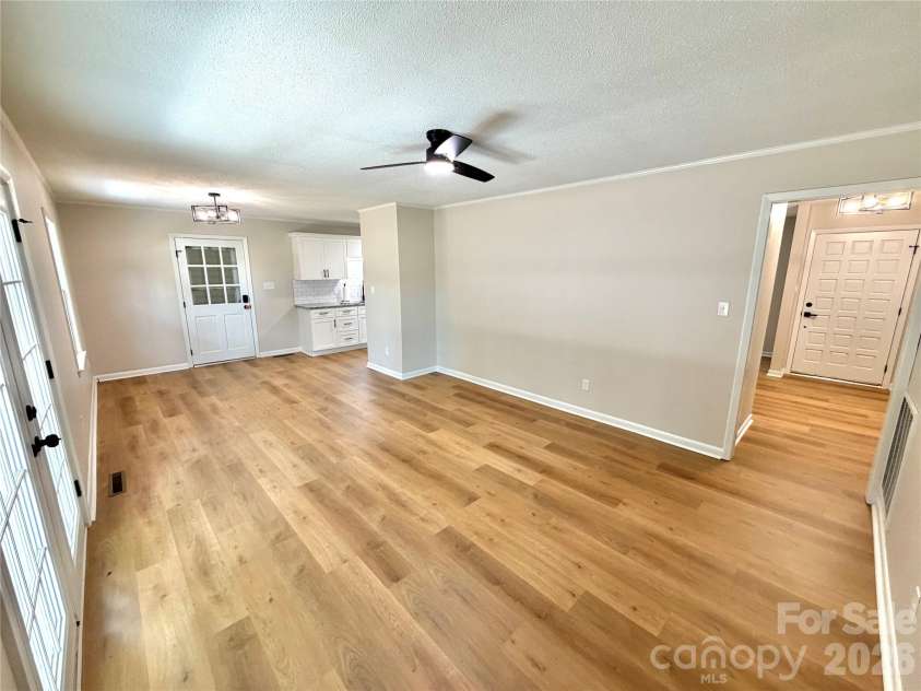 1880 Woodridge Circle, Hickory, NC 28602.  MLS# CAR4389605, YatesRealty ID 28477. Back of house living/dining room
