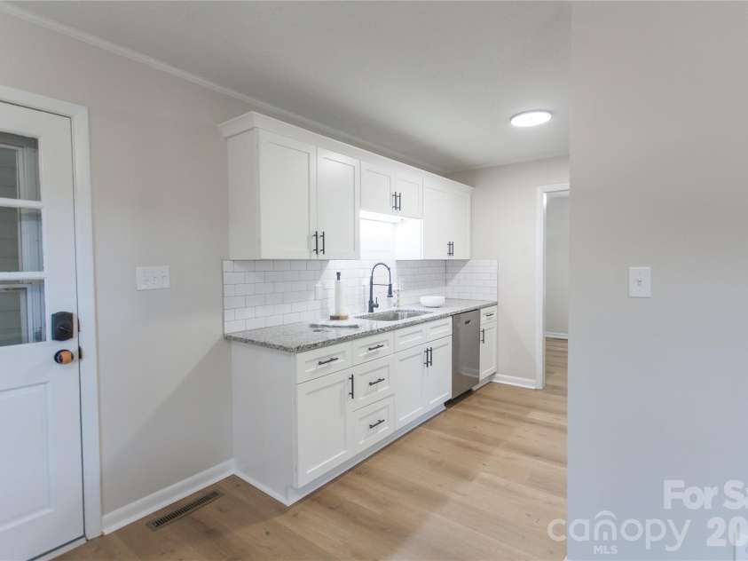 1880 Woodridge Circle, Hickory, NC 28602.  MLS# CAR4389605, YatesRealty ID 28477. Kitchen access from carport