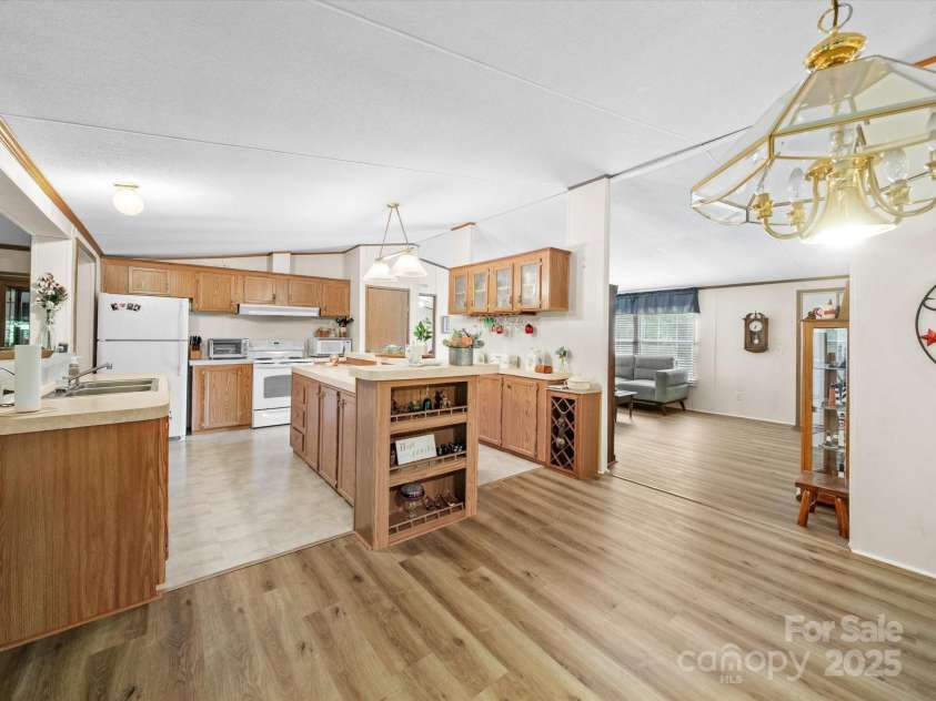3911 Doster Road, Monroe, NC 28112.  MLS# CAR4277789, YatesRealty ID 28478. Huge kitchen open to Living Room