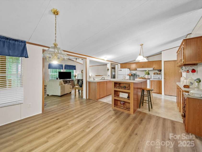 3911 Doster Road, Monroe, NC 28112.  MLS# CAR4277789, YatesRealty ID 28478. Kitchen into Family Room