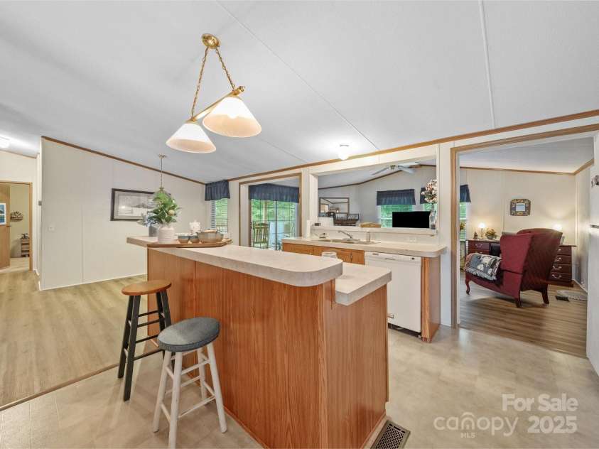 3911 Doster Road, Monroe, NC 28112.  MLS# CAR4277789, YatesRealty ID 28478. Kitchen into Family Room