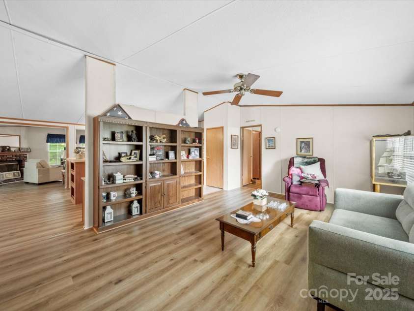 3911 Doster Road, Monroe, NC 28112.  MLS# CAR4277789, YatesRealty ID 28478. Living Room into kitchen