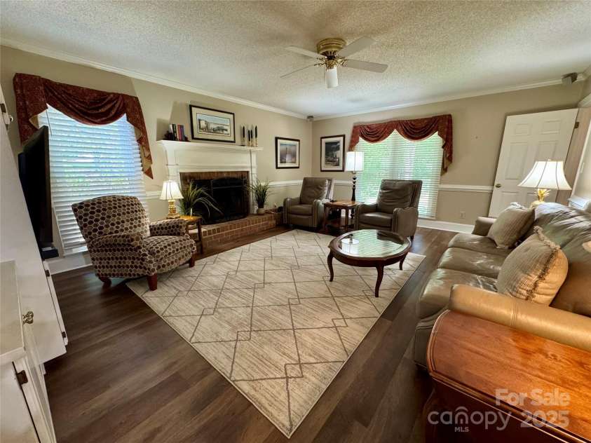 271 Ikerd Drive, Concord, NC 28025.  MLS# CAR4245802, YatesRealty ID 28479. Family room with gas logs in in the fireplace