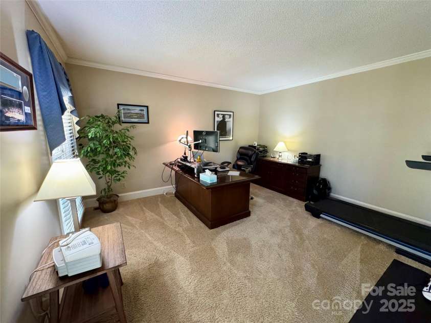271 Ikerd Drive, Concord, NC 28025.  MLS# CAR4245802, YatesRealty ID 28479. Living Room-currently used as an office-could be library or flex space. 