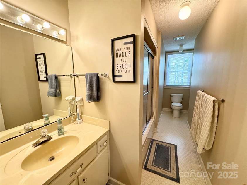 271 Ikerd Drive, Concord, NC 28025.  MLS# CAR4245802, YatesRealty ID 28479. Upstairs hall bath
