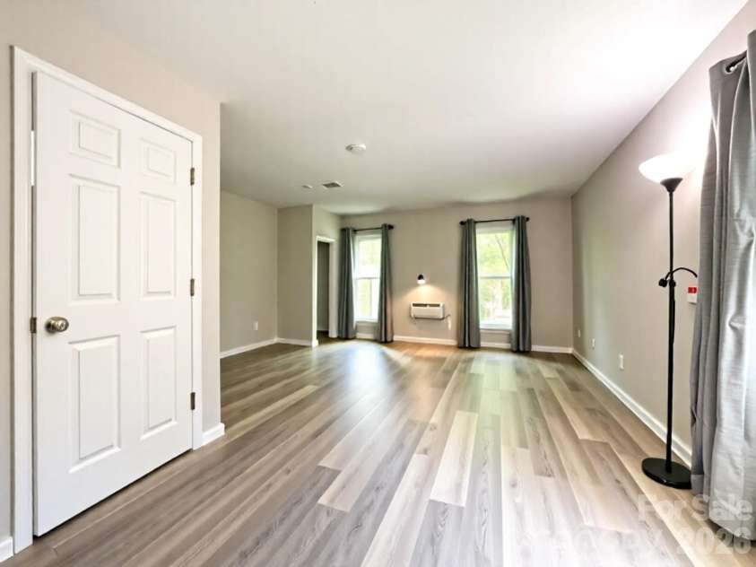 2113 Killarney Place, Charlotte, NC 28262.  MLS# CAR4247042, YatesRealty ID 2848. Empty primary bedroom with three large windows