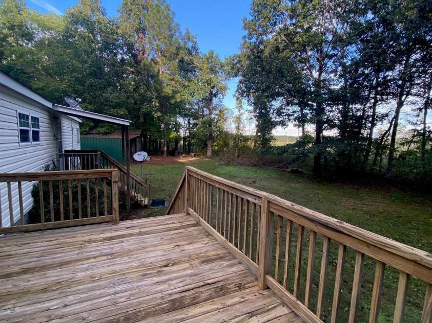 176 Hunters Glen Road, Troy, NC 27371.  MLS# CAR4281871, YatesRealty ID 28488. Back deck