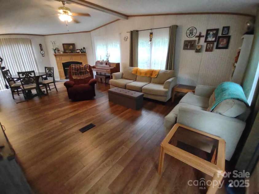 176 Hunters Glen Road, Troy, NC 27371.  MLS# CAR4281871, YatesRealty ID 28488. Living room