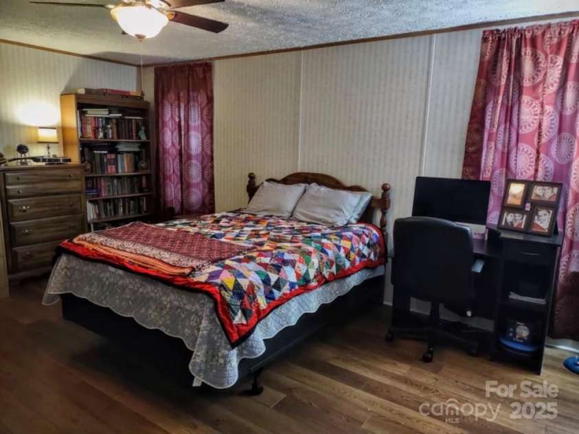 176 Hunters Glen Road, Troy, NC 27371.  MLS# CAR4281871, YatesRealty ID 28488. Primary bedroom