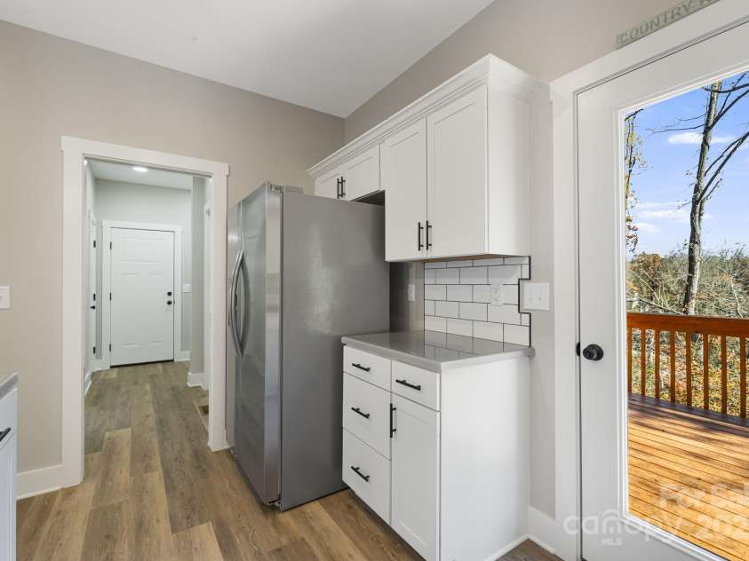 129 Brentwood Road, Morganton, NC 28655.  MLS# CAR4320475, YatesRealty ID 28491. Kitchen with deck