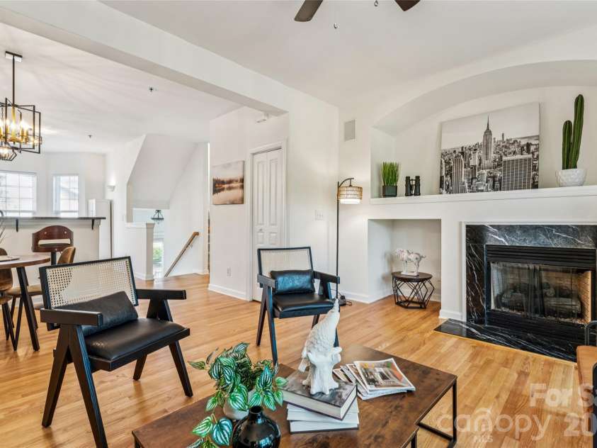 6333 Royal Celadon Way, Charlotte, NC 28269.  MLS# CAR4385329, YatesRealty ID 28493. This inviting space boasts a thoughtfully designed interior, highlighted by a generously sized, cut-out alcove, specifically crafted to accommodate a large television, ensuring optimal viewing pleasure. Complementin