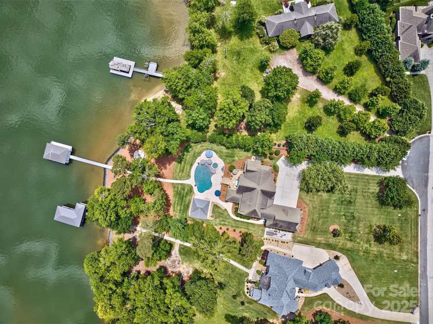 6216 North Road, York, SC 29745.  MLS# CAR4270896, YatesRealty ID 28499. Aerial view of home, dock, and water