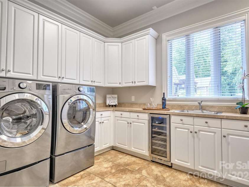 6216 North Road, York, SC 29745.  MLS# CAR4270896, YatesRealty ID 28499. Massive laundry room with storage and soaking sink