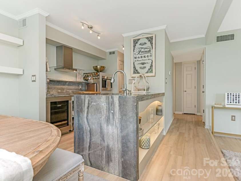 212 10th Street, Charlotte, NC 28202.  MLS# CAR4394129, YatesRealty ID 285. Kitchen with marble waterfall countertop