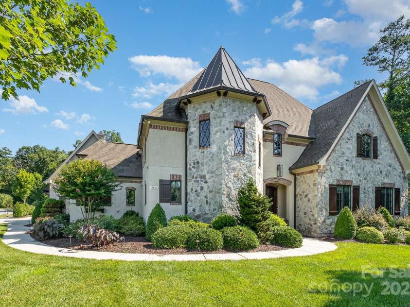 15603 June Washam Road, Davidson, NC 28036.  MLS# CAR4273381, YatesRealty ID 28502. French Country Stone and Stucco