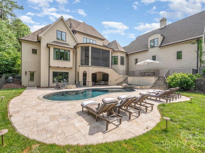 15603 June Washam Road, Davidson, NC 28036.  MLS# CAR4273381, YatesRealty ID 28502. Salt Water Pool with Travertine Pool Decking. 