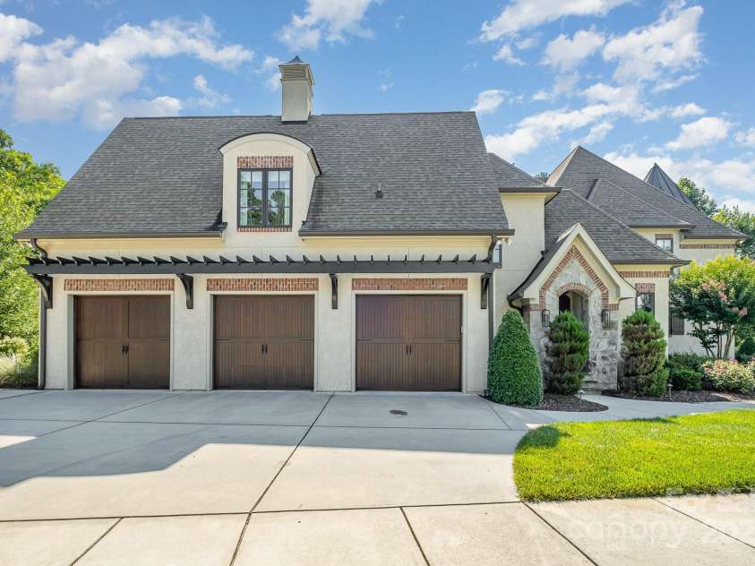 15603 June Washam Road, Davidson, NC 28036.  MLS# CAR4273381, YatesRealty ID 28502. Three car garage