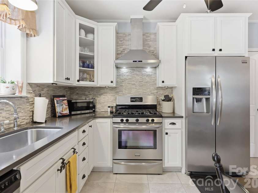 106 Maple Street, Fort Mill, SC 29715.  MLS# CAR4388689, YatesRealty ID 28504. Stainless appliances. Fridge remains.