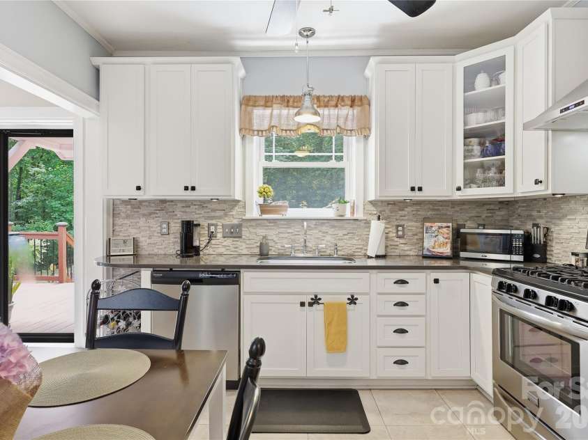 106 Maple Street, Fort Mill, SC 29715.  MLS# CAR4388689, YatesRealty ID 28504. Tile floors, quartz counters and designer backsplash.