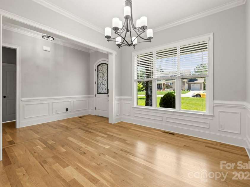 4930 Killian Crossing Drive, Denver, NC 28037.  MLS# CAR4277550, YatesRealty ID 28507. An elegant light fixture and intricate moldings further enhance the formal dining room