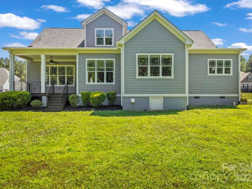 4930 Killian Crossing Drive, Denver, NC 28037.  MLS# CAR4277550, YatesRealty ID 28507. Enjoy peaceful privacy in your fully fenced backyard with no homes directly behind—just a tree-lined buffer that enhances the view and serenity.