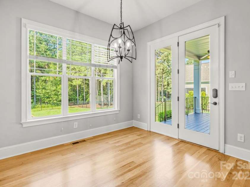 4930 Killian Crossing Drive, Denver, NC 28037.  MLS# CAR4277550, YatesRealty ID 28507. Relax in style: A cozy gas fireplace and full wood accent wall make this space as warm as it is sophisticated