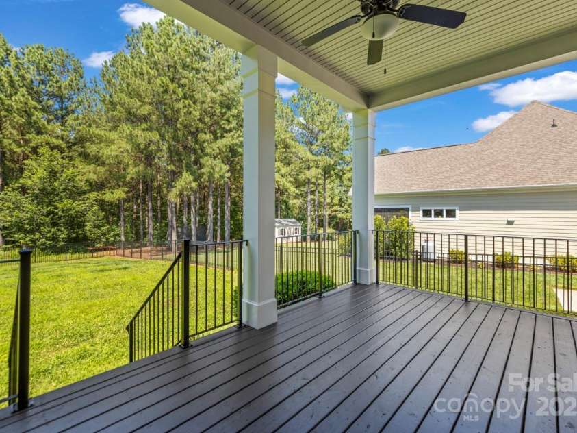 4930 Killian Crossing Drive, Denver, NC 28037.  MLS# CAR4277550, YatesRealty ID 28507. Vies of the level rear yard from the covered deck
