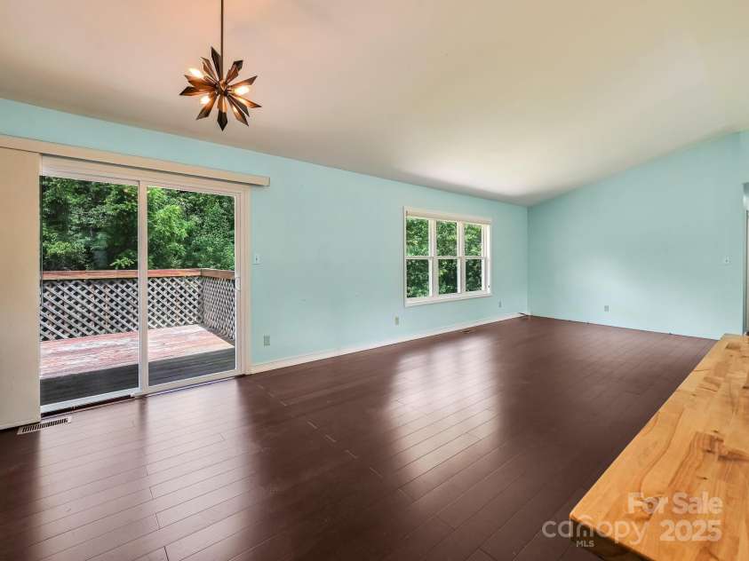 14 Spring Lake Drive, Fletcher, NC 28732.  MLS# CAR4270829, YatesRealty ID 28509. Dining/Great Room to Back Deck