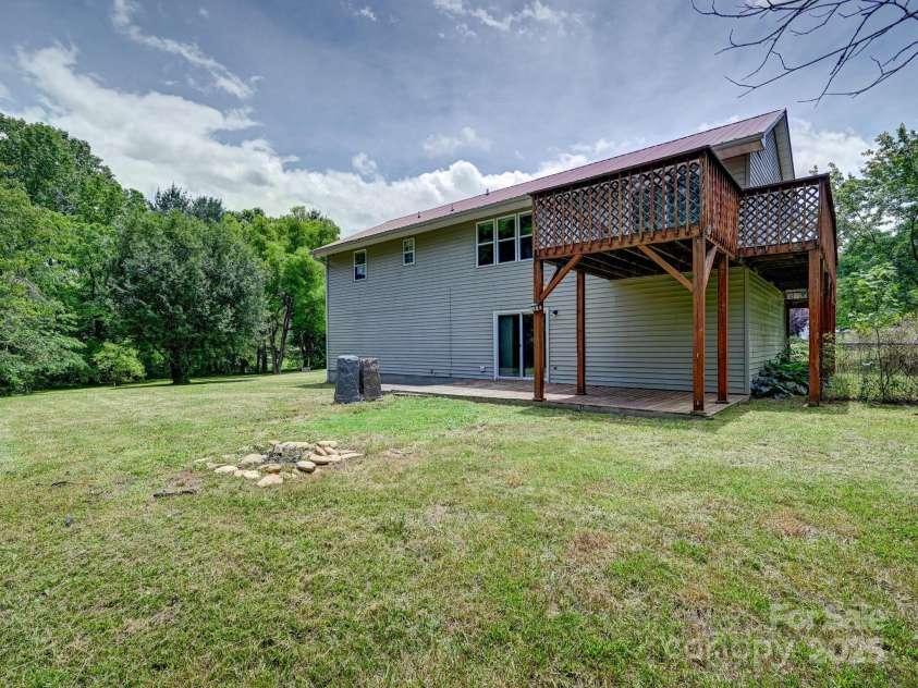 14 Spring Lake Drive, Fletcher, NC 28732.  MLS# CAR4270829, YatesRealty ID 28509. Level Backyard with Firepit