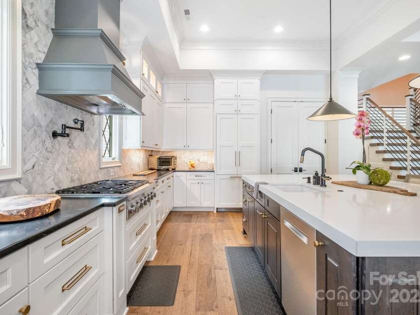 708 Amalfi Drive, Davidson, NC 28036.  MLS# CAR4281253, YatesRealty ID 28511. Atop of the oversized island sits a seamless slab of 3