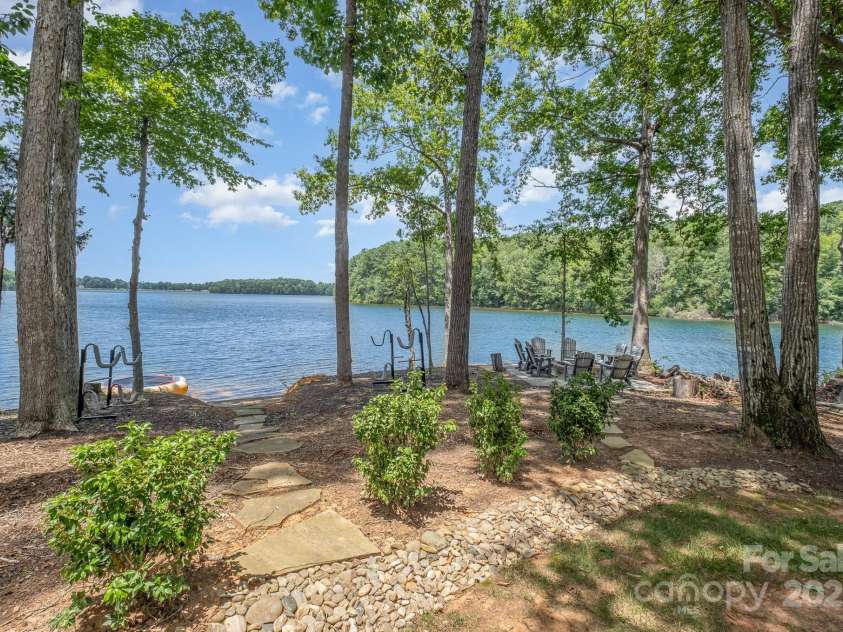 708 Amalfi Drive, Davidson, NC 28036.  MLS# CAR4281253, YatesRealty ID 28511. Beautiful views with private water access and private sandy beach with paddle sport launch.