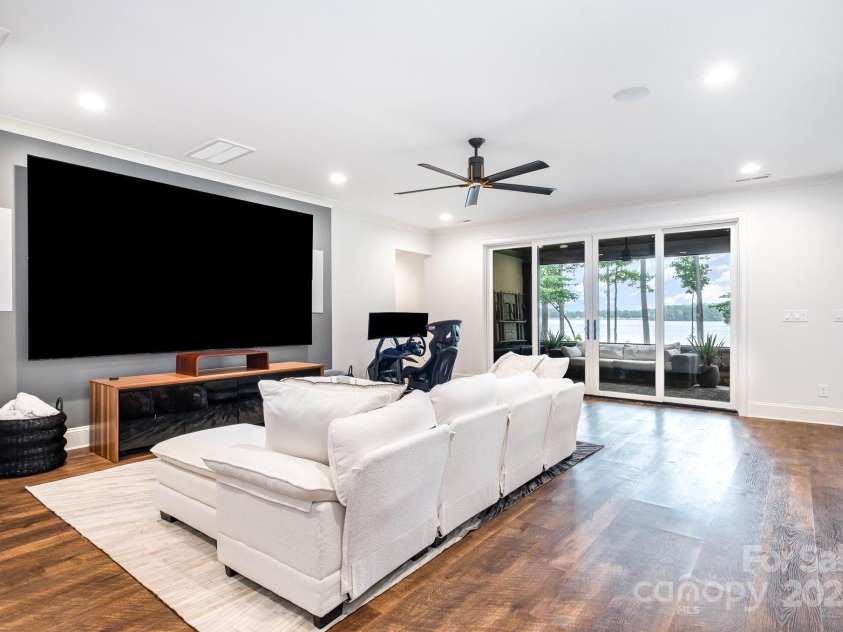 708 Amalfi Drive, Davidson, NC 28036.  MLS# CAR4281253, YatesRealty ID 28511. Lower level bonus room features 4 screen TV.  You can watch 4 games or use all 4 to watch one!