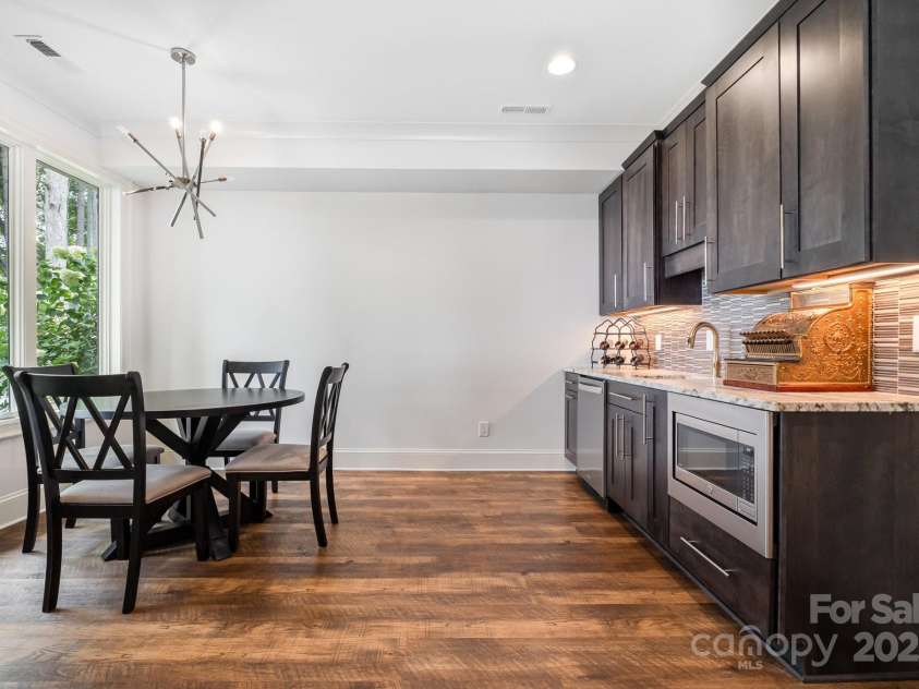 708 Amalfi Drive, Davidson, NC 28036.  MLS# CAR4281253, YatesRealty ID 28511. Lower level kitchenette features under counter beverage refrigerator, sink and microwave.