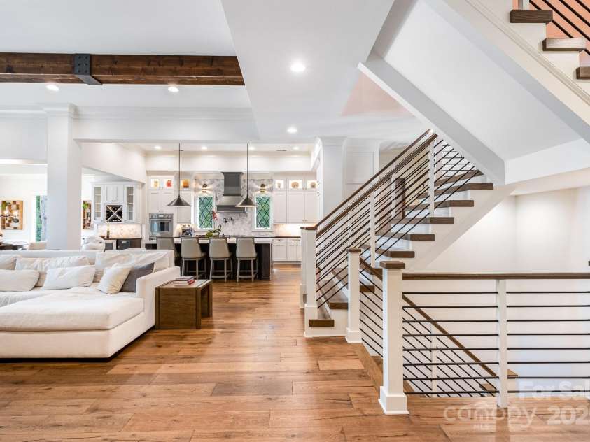 708 Amalfi Drive, Davidson, NC 28036.  MLS# CAR4281253, YatesRealty ID 28511. Open trasitioal staricase with horizontal, powder coated balusters.