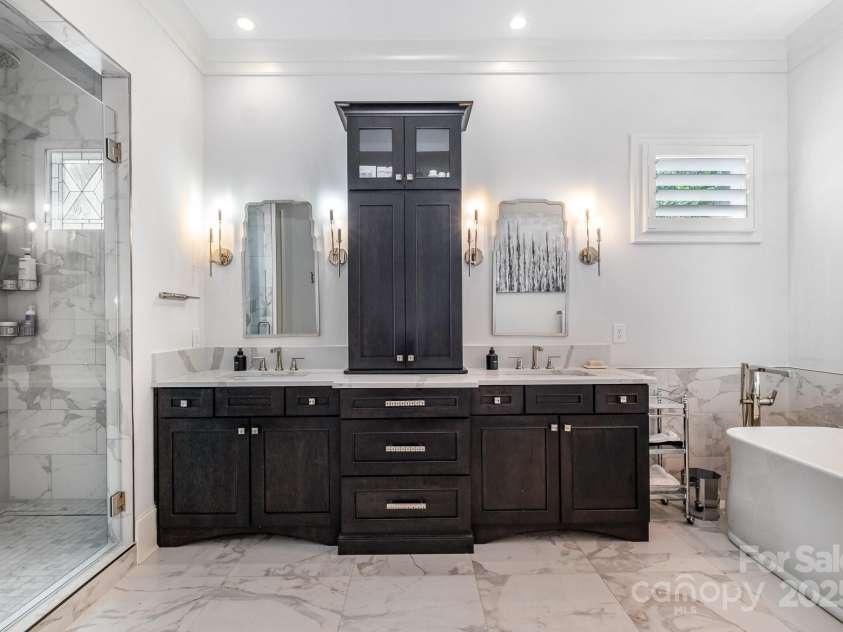 708 Amalfi Drive, Davidson, NC 28036.  MLS# CAR4281253, YatesRealty ID 28511. Primary Bath double vanities exquisite Calacata Italian Porcelain tile.