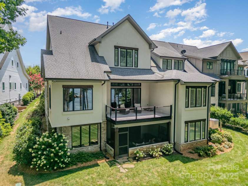 708 Amalfi Drive, Davidson, NC 28036.  MLS# CAR4281253, YatesRealty ID 28511. Rear elevation, walls of glass in nearly every room