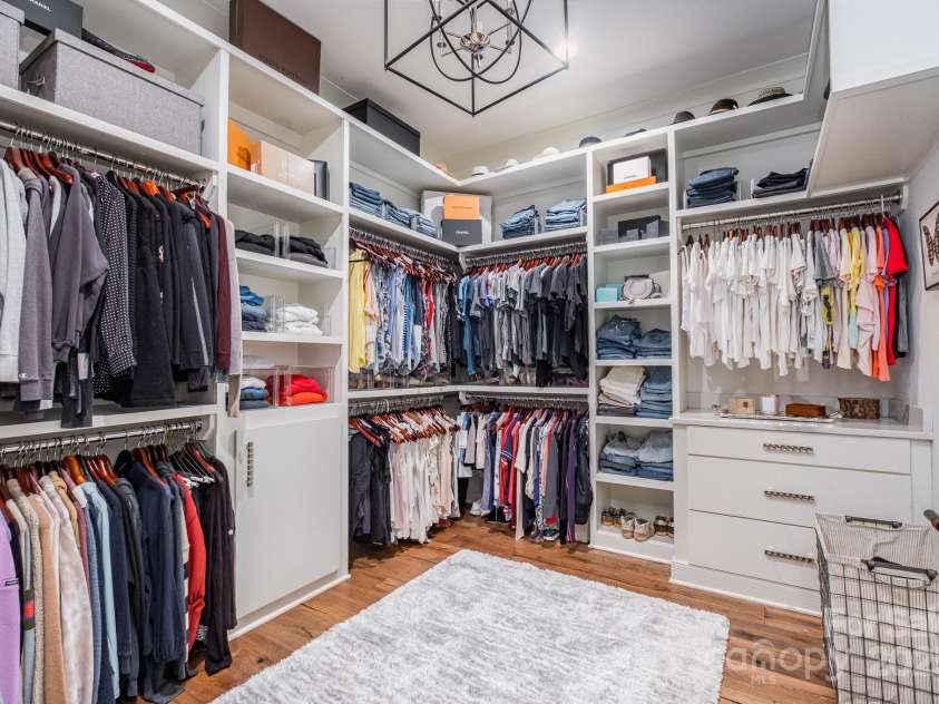 708 Amalfi Drive, Davidson, NC 28036.  MLS# CAR4281253, YatesRealty ID 28511. Walk in closet custom shelving and storage features
