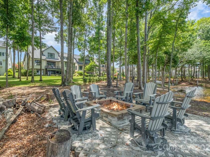 708 Amalfi Drive, Davidson, NC 28036.  MLS# CAR4281253, YatesRealty ID 28511. Waterfront fire pit for stunning sunsets.