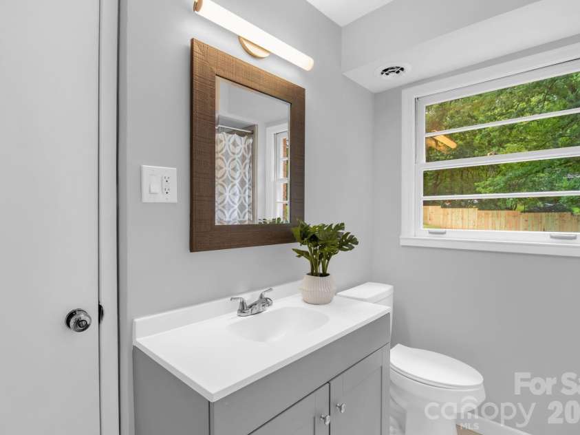 1623 Lumarka Drive, Charlotte, NC 28212.  MLS# CAR4385978, YatesRealty ID 28512. Downstairs bathroom