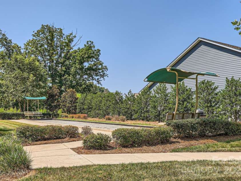128 Championship Drive, Mooresville, NC 28115.  MLS# CAR4253637, YatesRealty ID 28518. Bocce ball court on the other side of the neighborhood