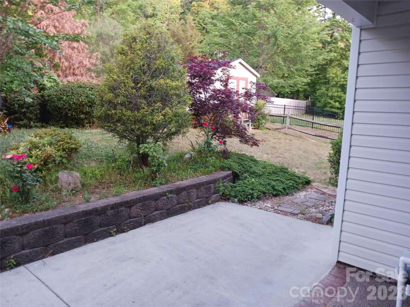 5039 Abbington Way, Belmont, NC 28012.  MLS# CAR4382097, YatesRealty ID 28518. BACK PATIO TOWARDS REAR STORAGE BLDG