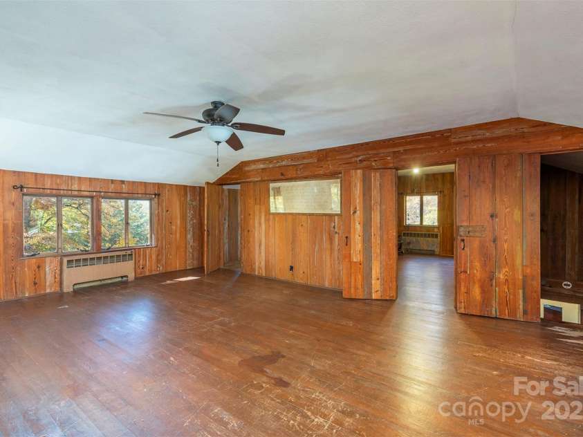 102 Weaver Mill Road, Columbus, NC 28722.  MLS# CAR4211548, YatesRealty ID 2852. A spacious living/recreation area outside of the second floor bedroom