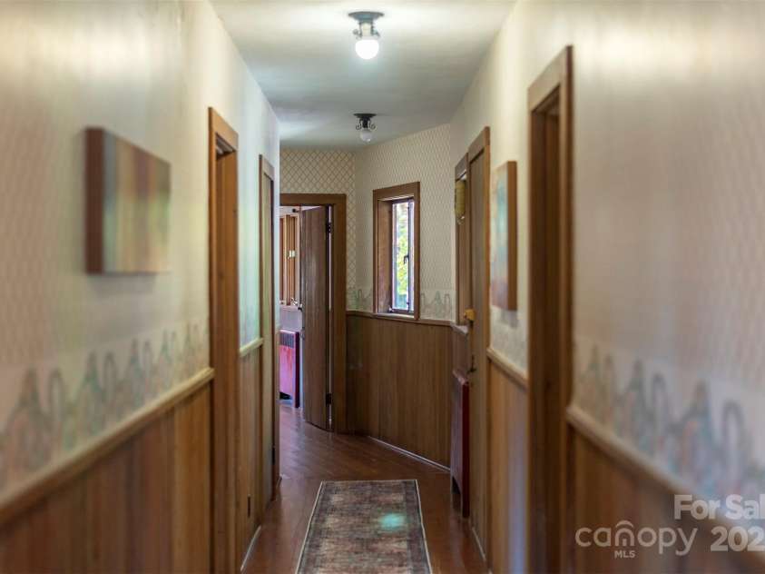 102 Weaver Mill Road, Columbus, NC 28722.  MLS# CAR4211548, YatesRealty ID 2852. Hallway leading to the bedrooms, with plenty of storage space along the way