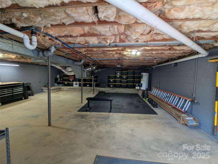 51 Miller Avenue, Marion, NC 28752.  MLS# CAR4221132, YatesRealty ID 2853. Basement Workout room