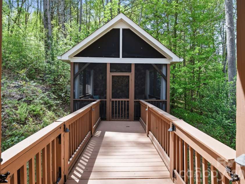 280 Bear River Lodge Trail, Marshall, NC 28753.  MLS# CAR4370579, YatesRealty ID 28530. Deck Bridge Connects Main House with Screened Sanctuary