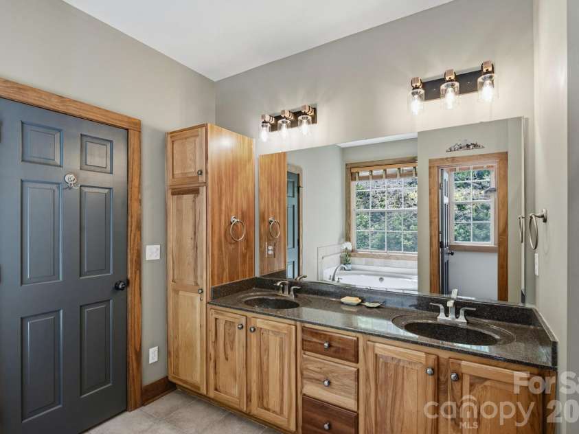 280 Bear River Lodge Trail, Marshall, NC 28753.  MLS# CAR4370579, YatesRealty ID 28530. Double Vanity and Ample Storage In Ensuite Full Bath