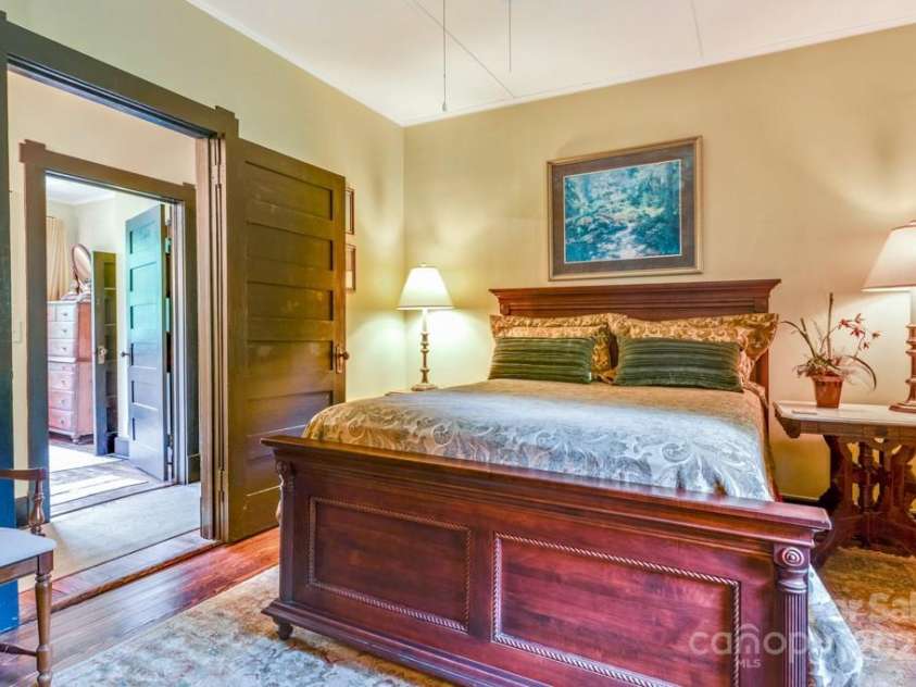 75 Charles Street, Saluda, NC 28773.  MLS# CAR4280162, YatesRealty ID 28531. Bedroom 3 Primary Bedroom with ensuite bathroom