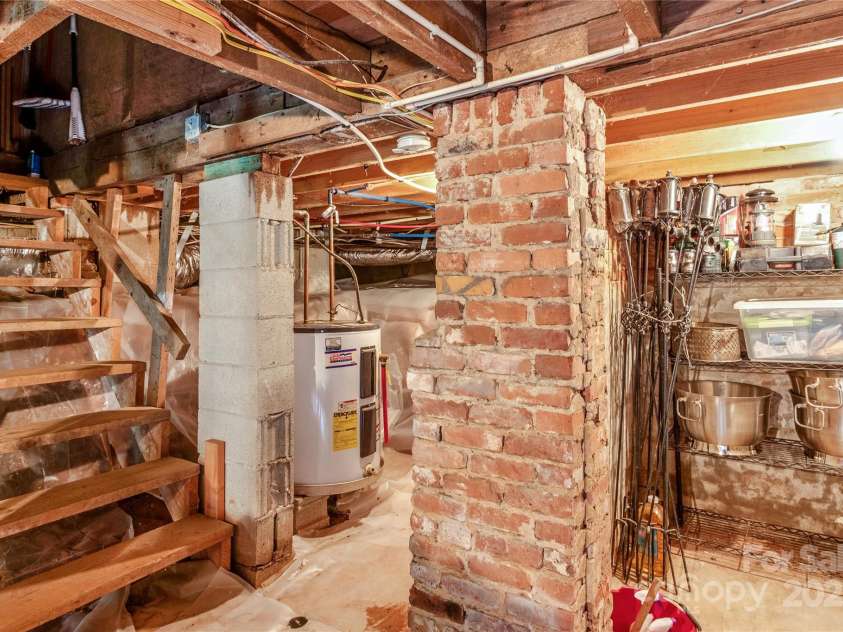 75 Charles Street, Saluda, NC 28773.  MLS# CAR4280162, YatesRealty ID 28531. Stairs from 1st floor to basement.  Root seller in this photo.