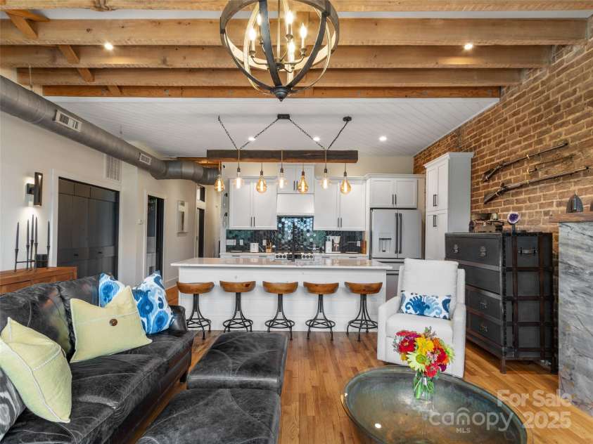 5 Town Square, Burnsville, NC 28714.  MLS# CAR4284216, YatesRealty ID 28535. Living Room looking in to Kitchen