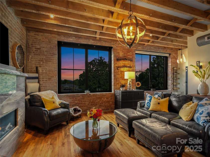 5 Town Square, Burnsville, NC 28714.  MLS# CAR4284216, YatesRealty ID 28535. Living Room Twilight